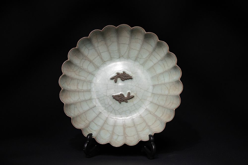 Lot 280: A Chinese Crackled Celadon Dish with Twin Fish...