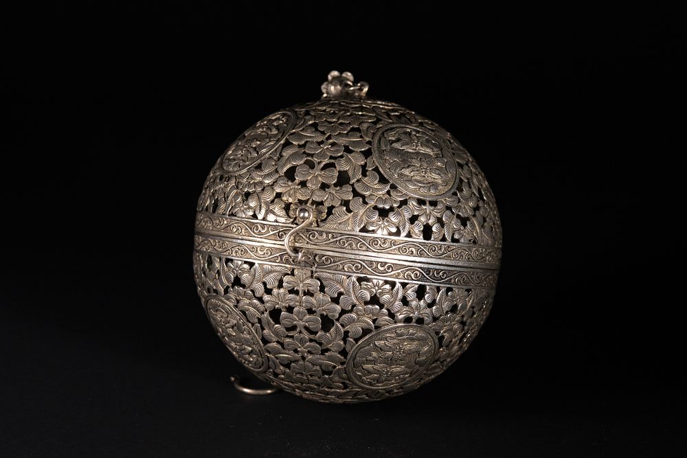 Lot 289: A Chinese White Metal Spherical Travelling Incense Burner.
