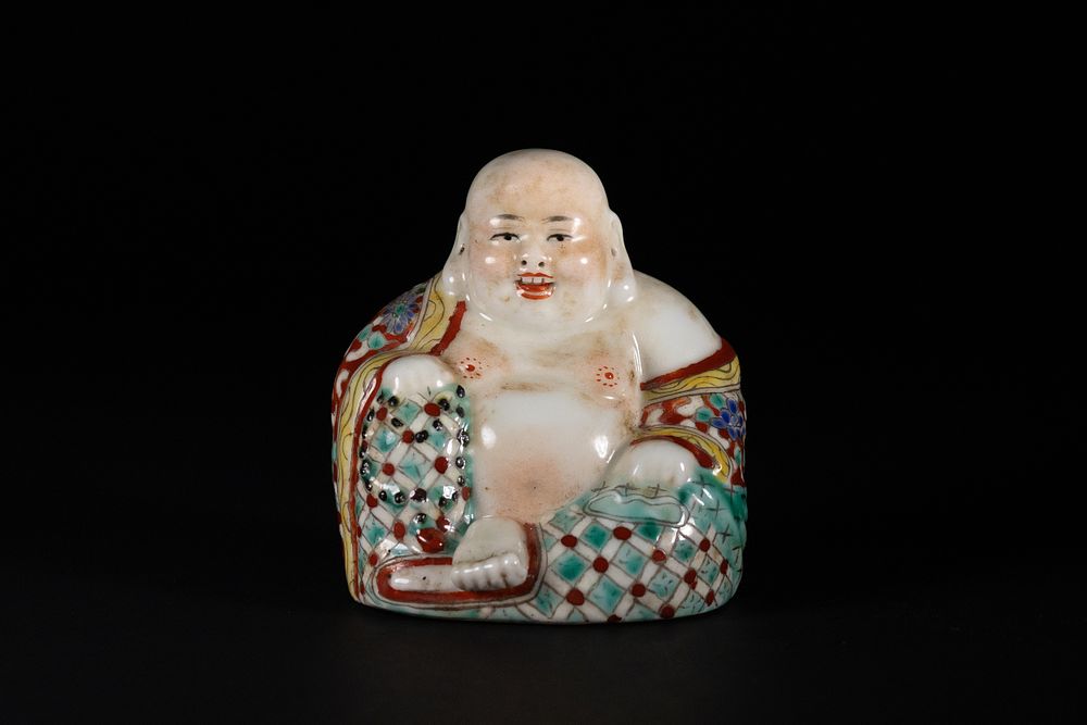 Lot 290: A Chinese Porcelain Seated Budai Figure with Polychrome...