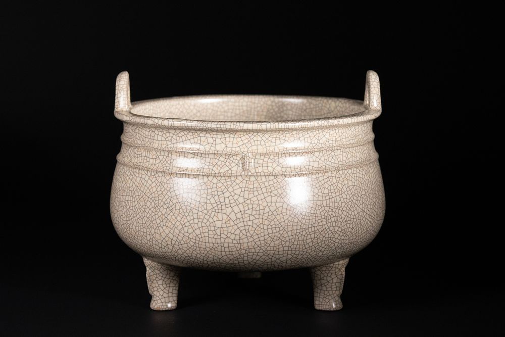 Lot 301: A Chinese Crackle-Glazed Tripod Censer.