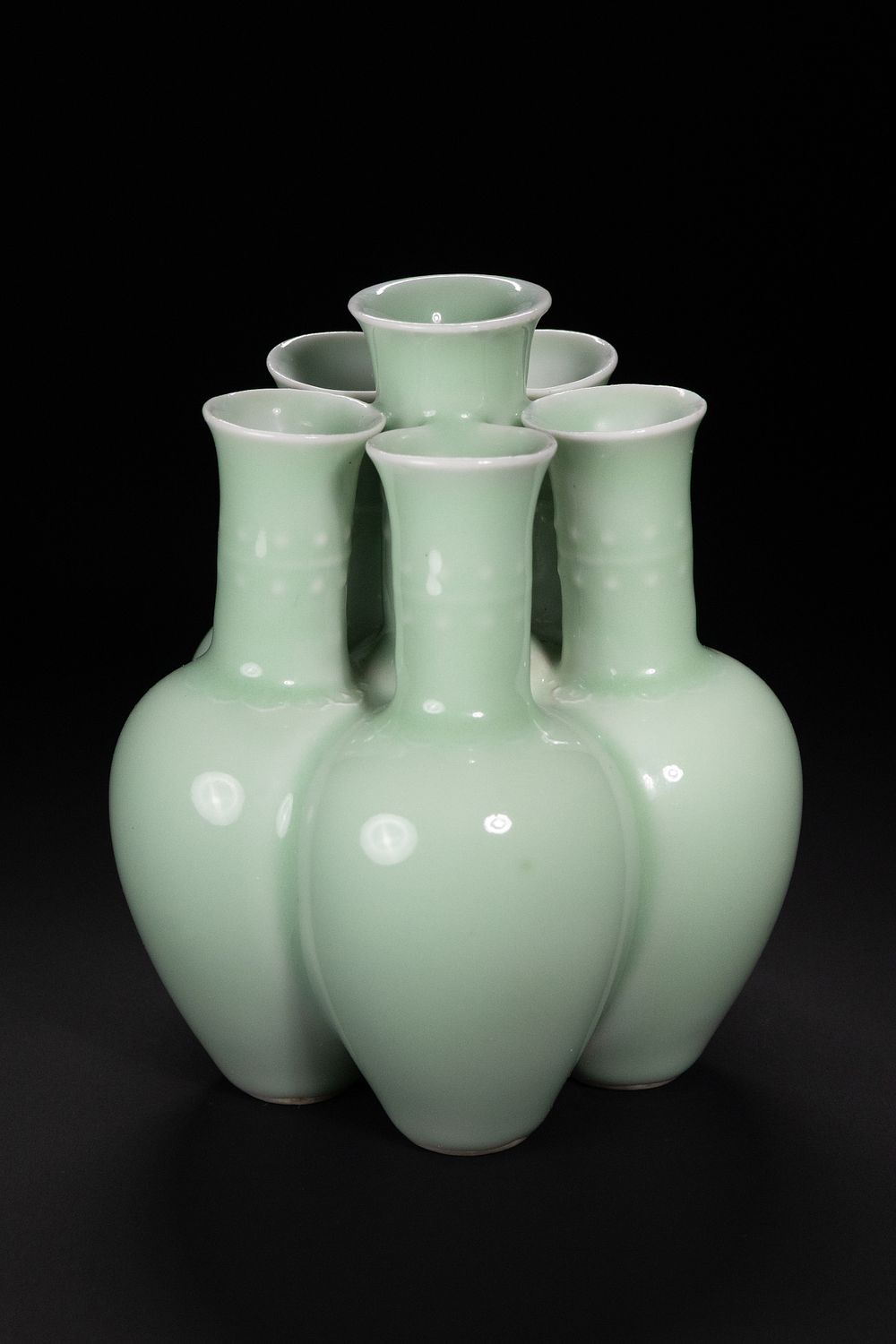 Lot 320: A Chinese Celadon-Glazed Porcelain 'Six-Neck' Vase.