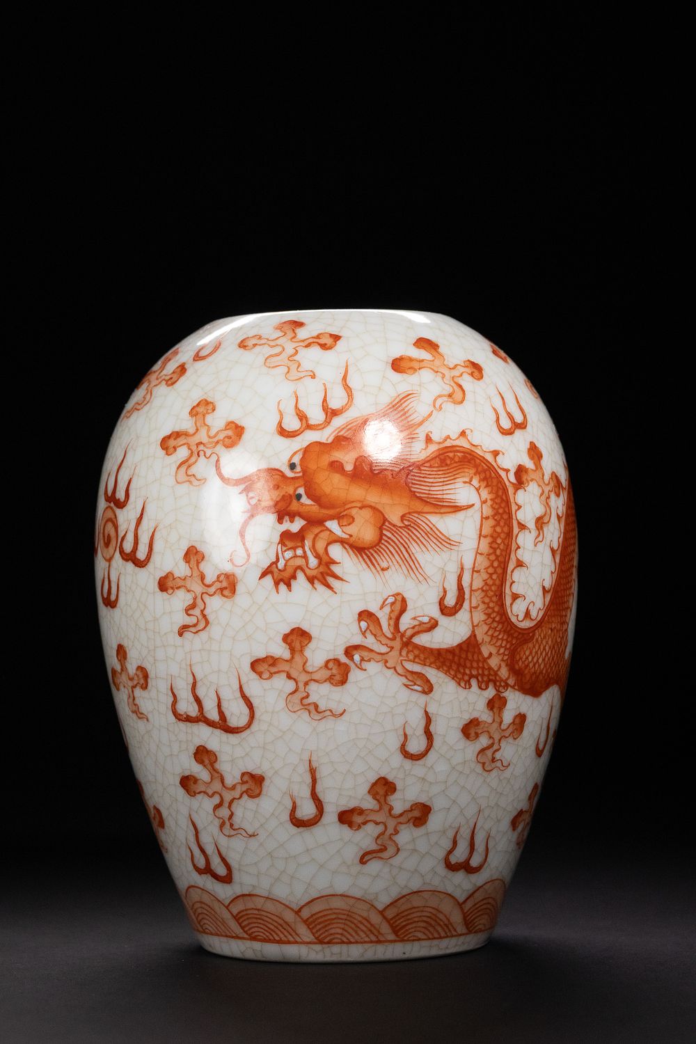 Lot 321: A Chinese Iron-Red Dragon and Cloud Crackled Porcelain...