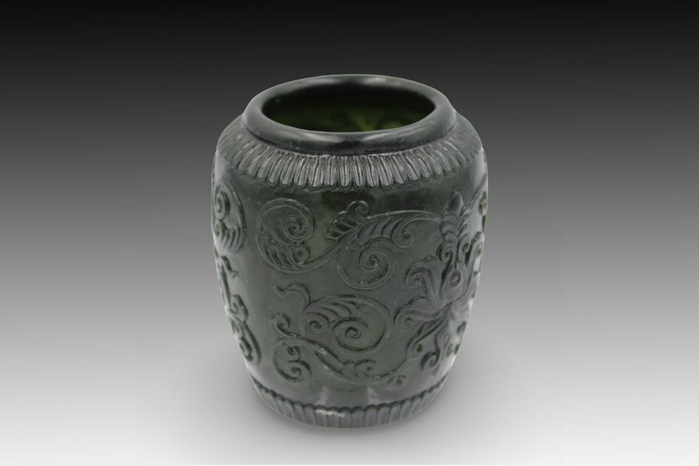 Lot 351: A Chinese Green Jade Vessel with Floral Scrollwork...
