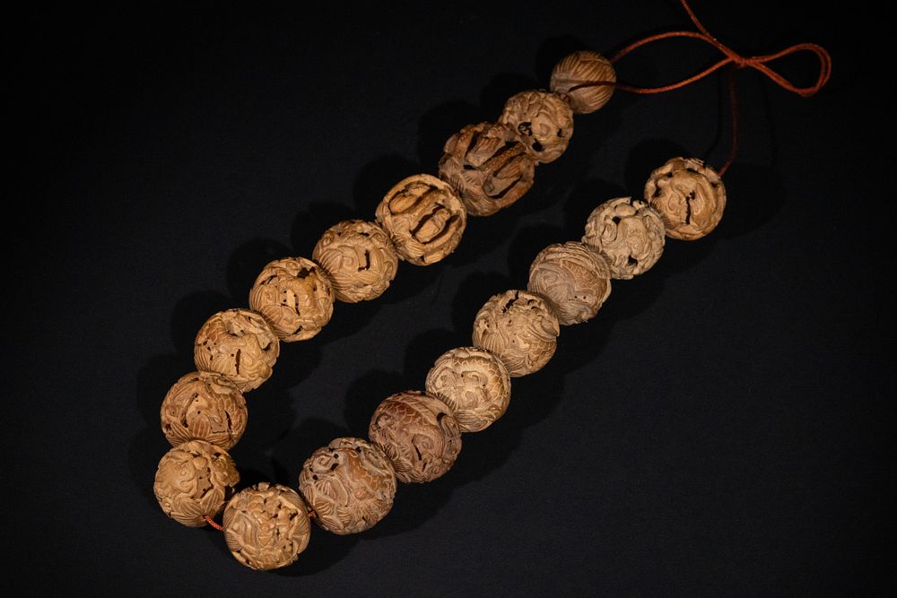 Lot 355: A Tibetan Short Necklace of Carved Seed Nut...