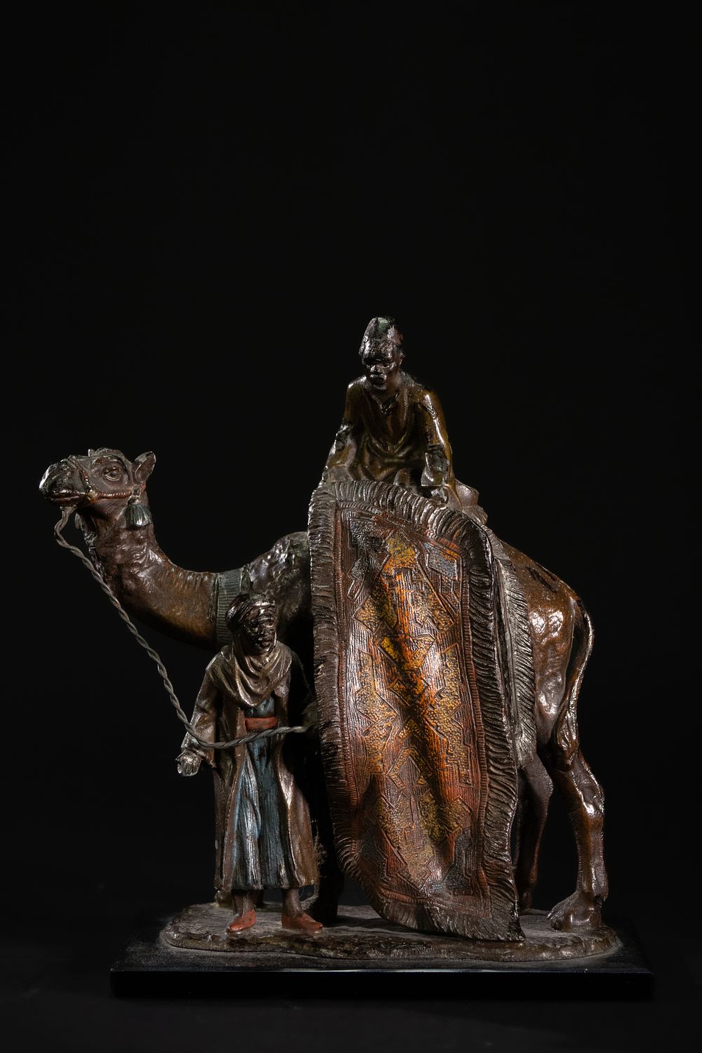 Lot 367: A Bergman Style Cold-Painted Spelter Camel Group.