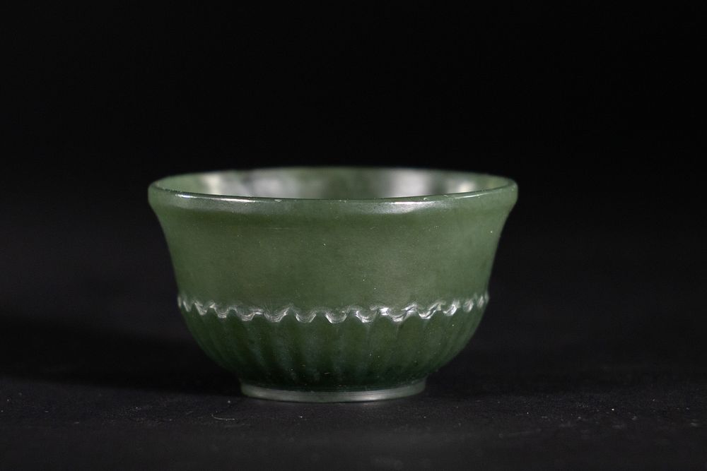 Lot 188: A Mughal Carved Green Jade Cup, 19th-20th Century.