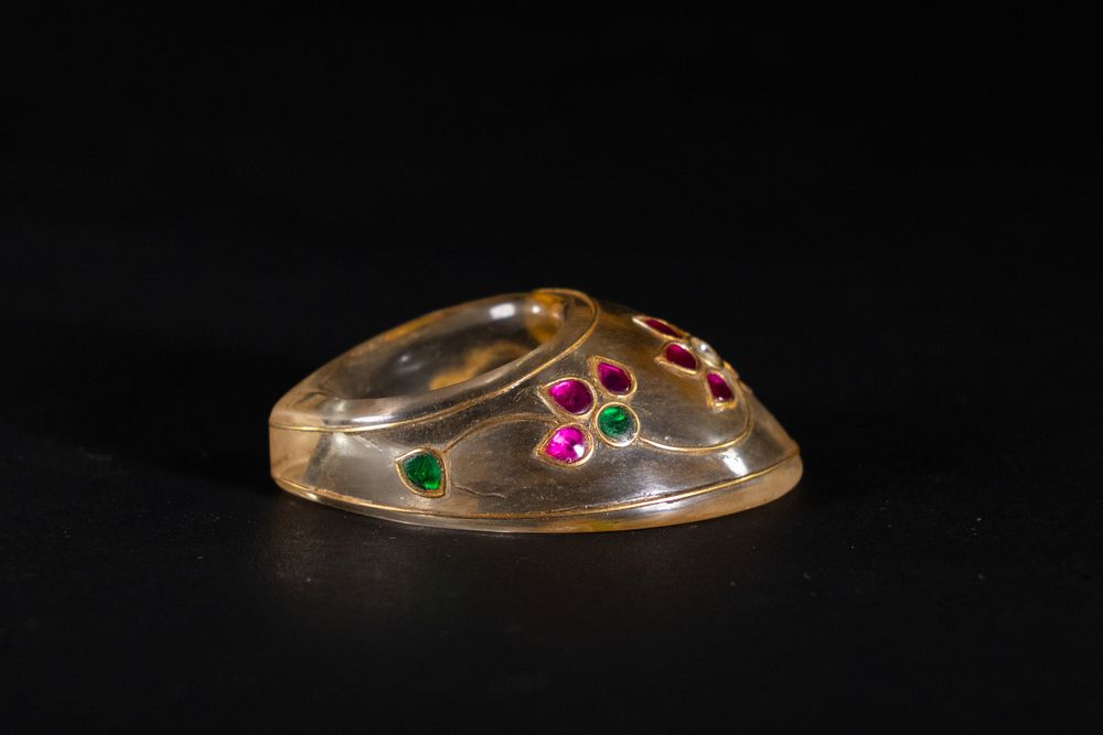 Lot 190: A Mughal Rock Crystal Archer’s Ring with Kundan...