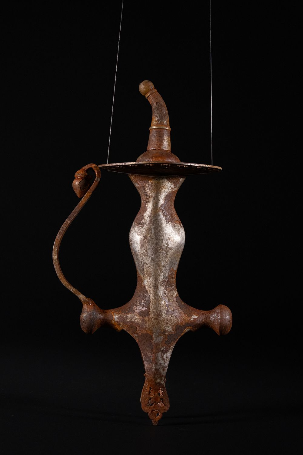 Lot 193: An Indian Iron Sword Hilt with Pierced Guard.