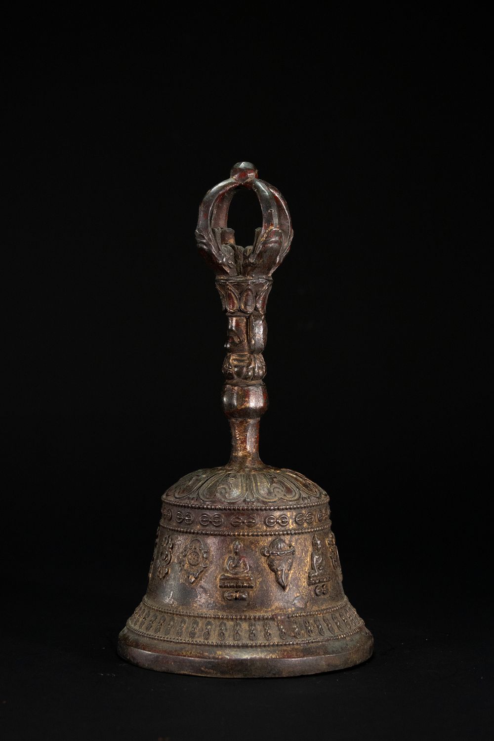 Lot 229: A Tibetan Bronze Ritual Bell with Vajra Handle.