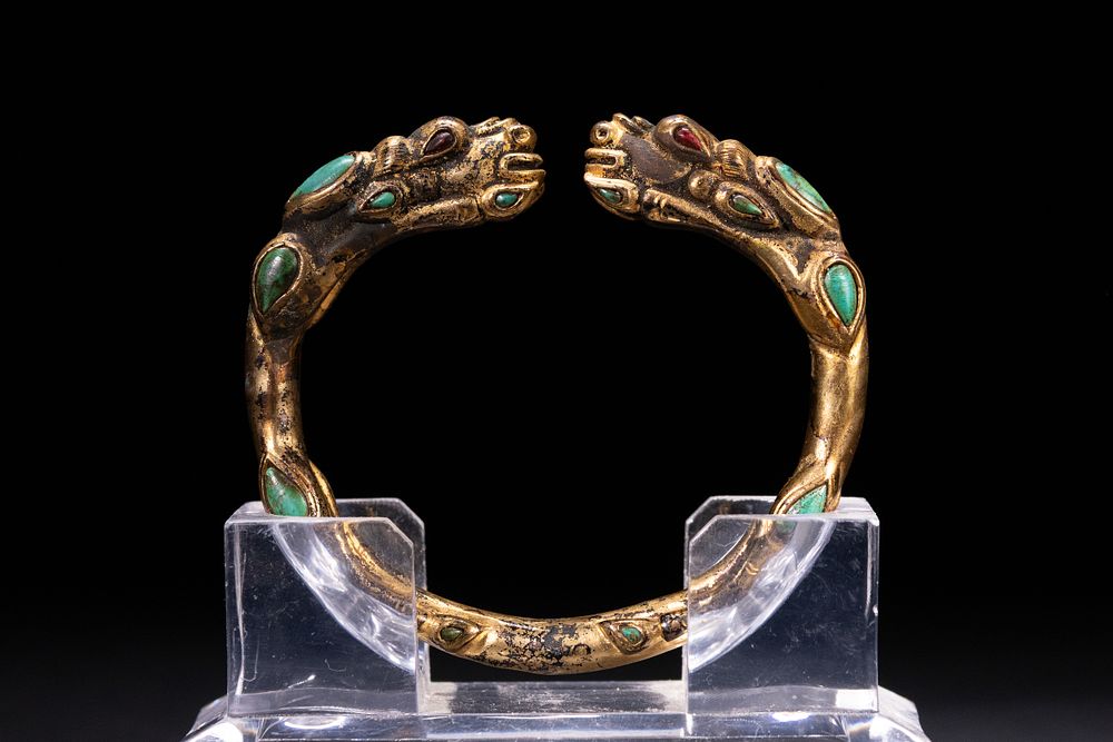 Lot 237: A Tibetan Gilt Bronze Dragon-Head Bracelet Inlaid with...