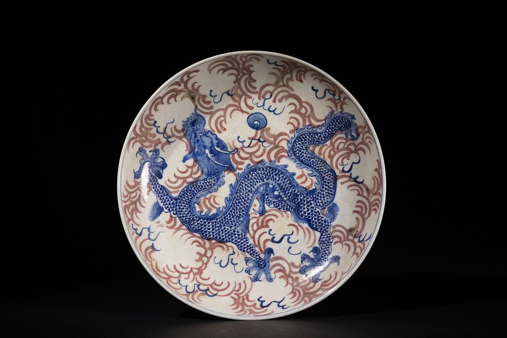 Lot 251: A Chinese Blue and White Dish with Iron-Red...