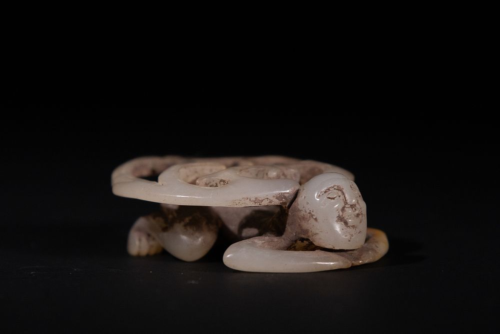 Lot 263: A Chinese White Jade Carving of a Reclining...