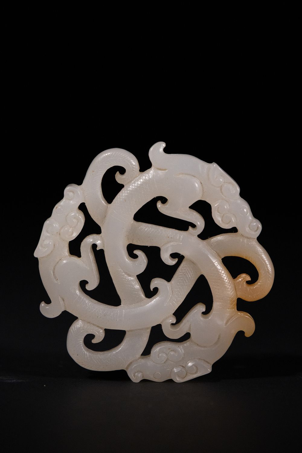 Lot 265: A Chinese White Jade Openwork Pendant with Dragon...