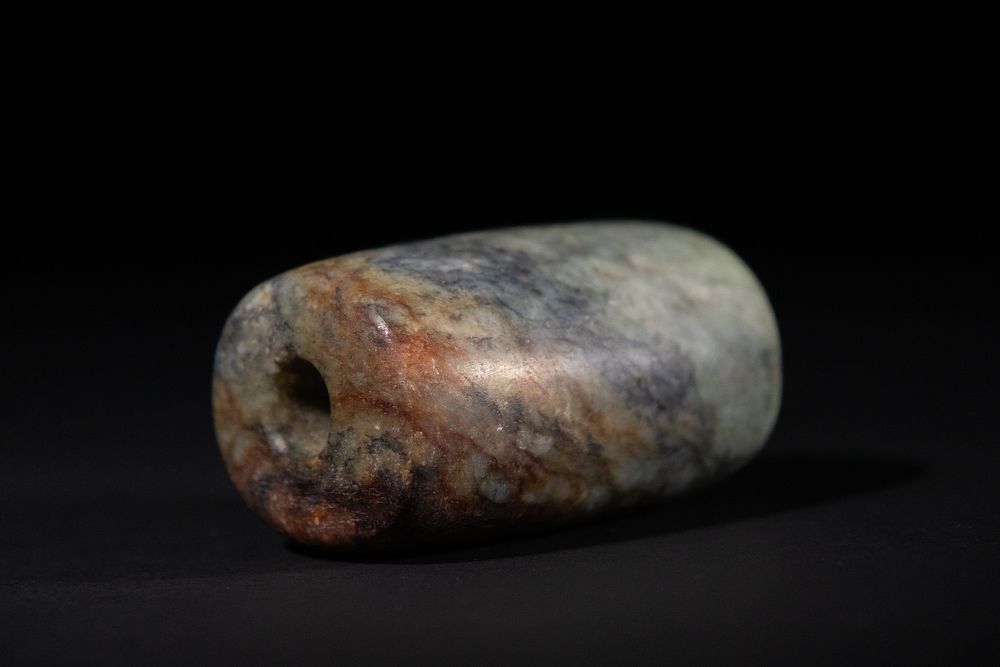 Lot 269: A Chinese Jade Cylindrical Ornament Bead.