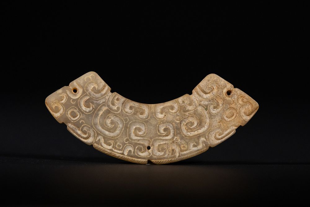 Lot 285: A Chinese Archaic Jade Huang Pendant, 19th Century.