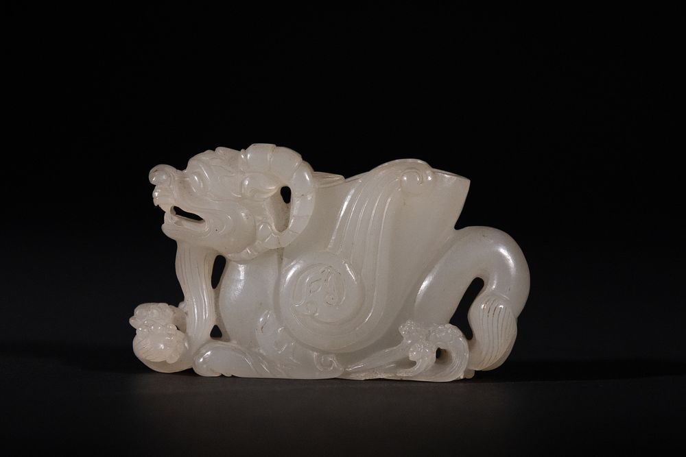 Lot 292: A Chinese White Jade Carving of a Mythical...