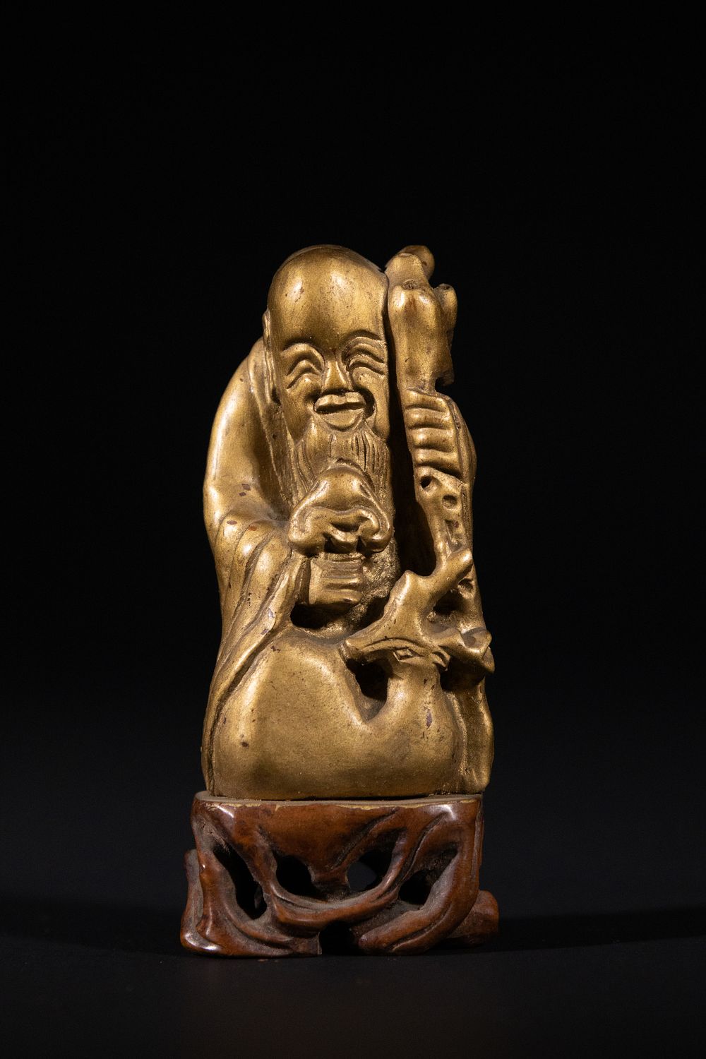Lot 293: A Chinese Gilt-Lacquered Wooden Figure of Shoulao, Qing...