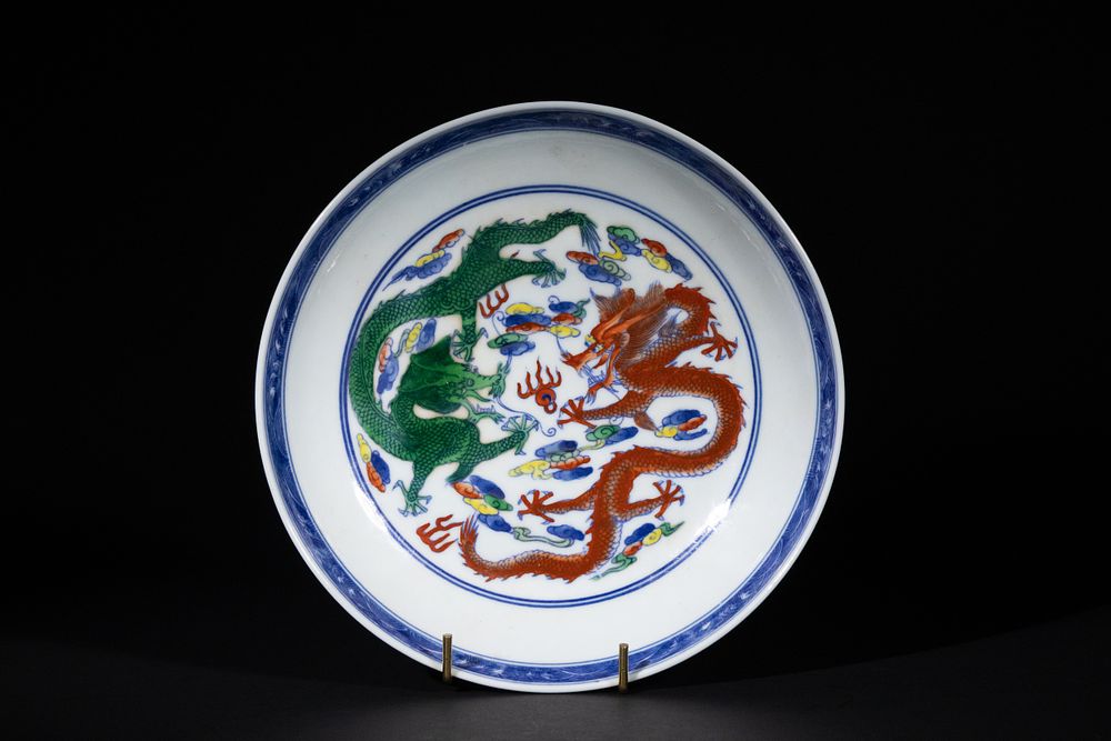 Lot 299: A Chinese Doucai Porcelain Dish with Two Dragons,...