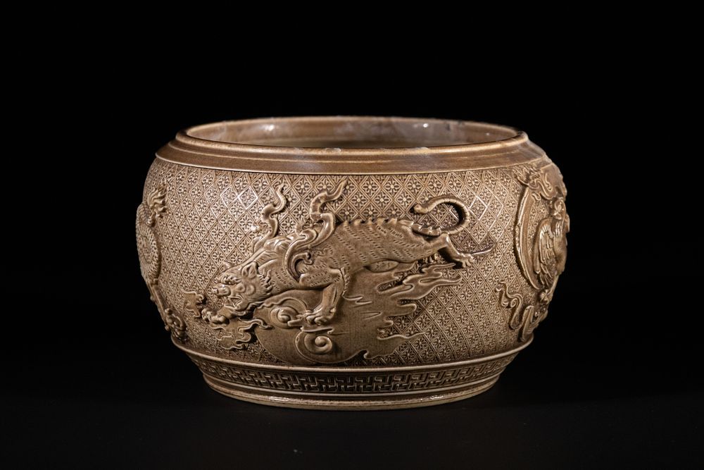 Lot 319: A Chinese Brown-Glazed Ceramic Jar with Dragon, Phoenix,...