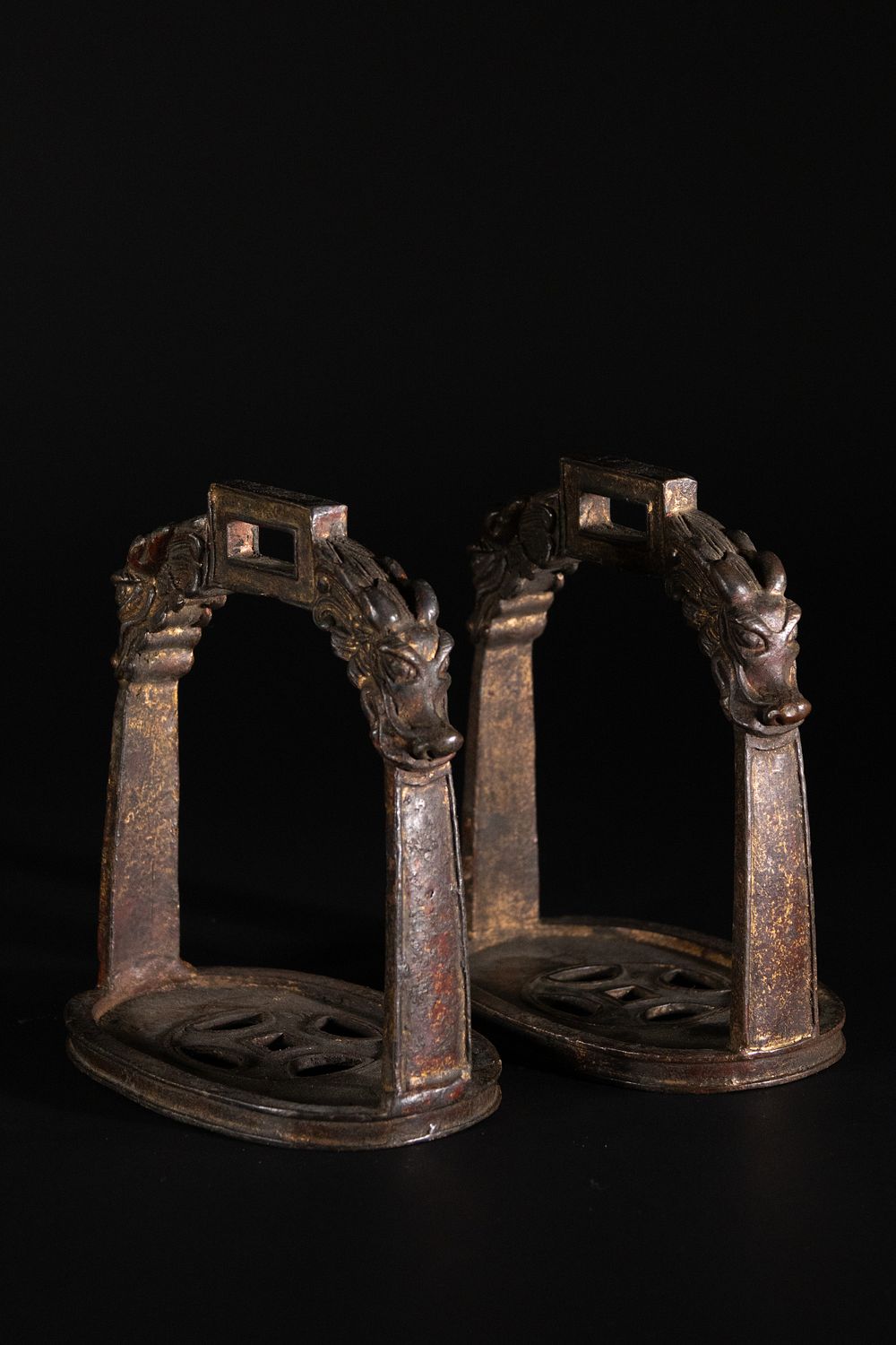 Lot 324: A Pair of Chinese Bronze Stirrups with Dragon-Head...