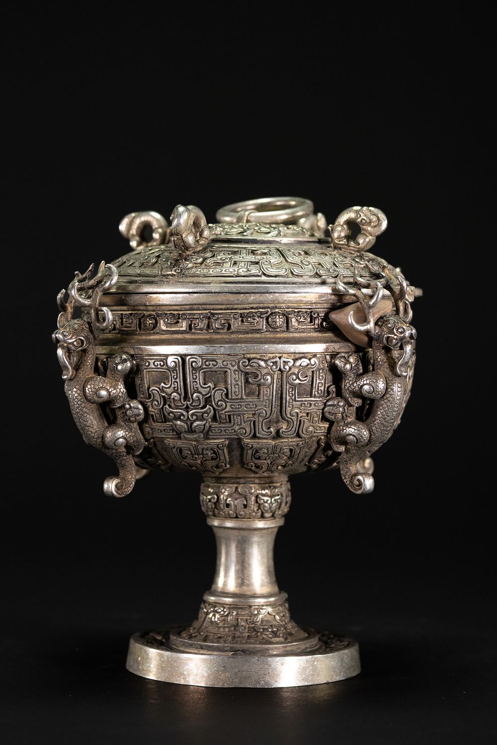 Lot 333: A Chinese White Metal Censor with Dragon Motifs.
