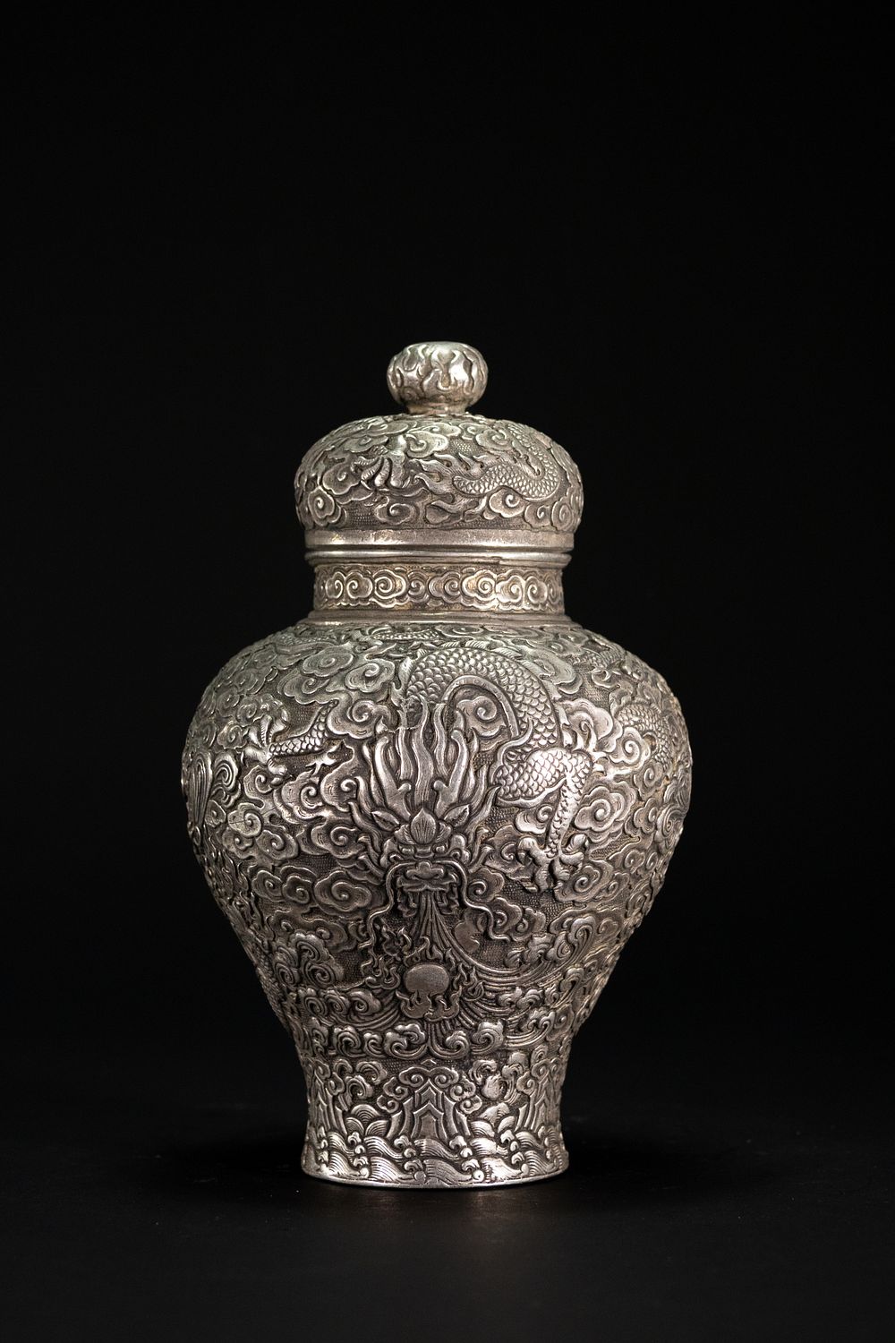Lot 335: A Chinese White Metal Lidded Jar with Dragon...