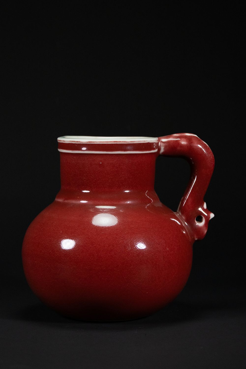 Lot 345: A Chinese Red Glazed Porcelain Jug with Dragon-Head...