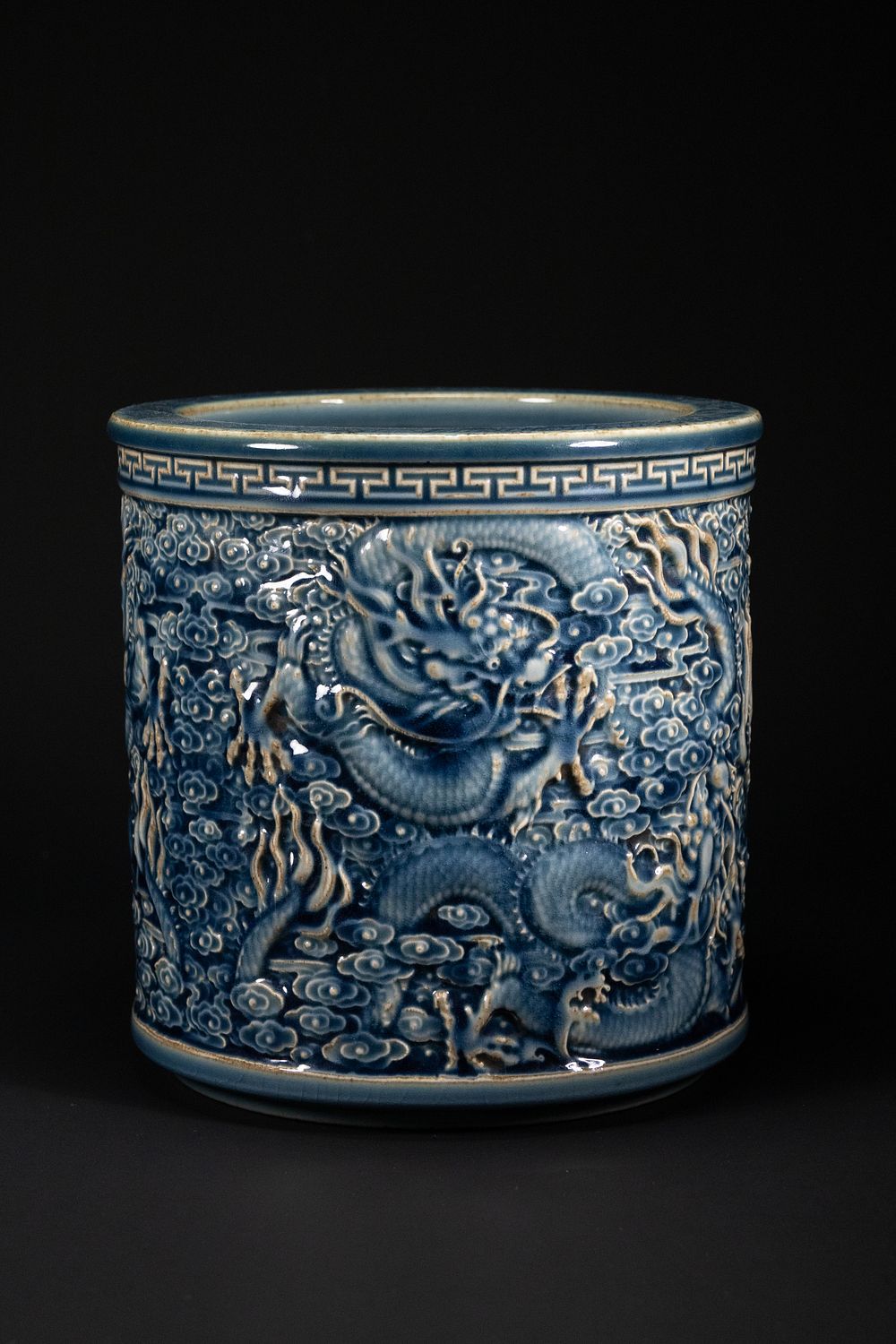 Lot 346: A Chinese Blue Glazed Relief-Decorated Brush Pot with...