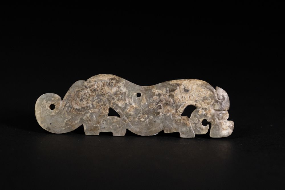 Lot 354: A Shang to Warring States Period Jade Tiger-Shaped...