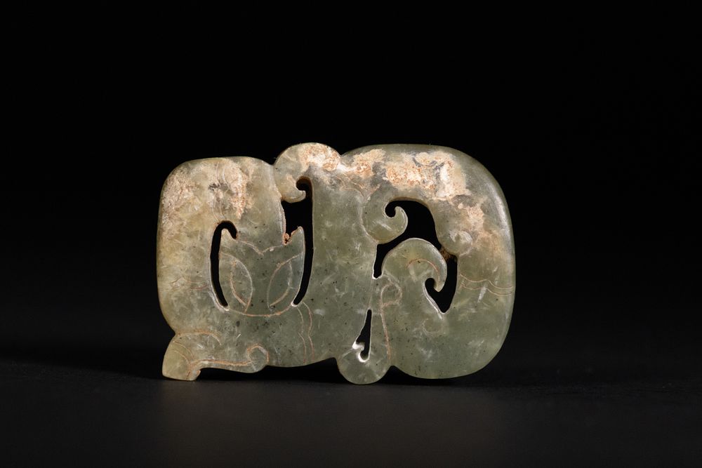 Lot 357: A Han Dynasty Dragon-Shaped Jade Ornament, circa 206...