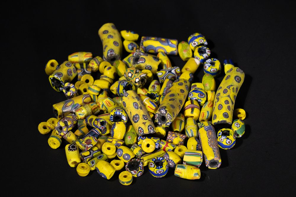 Lot 396: A Lot of Antique Yellow Millefiori Glass Beads.
