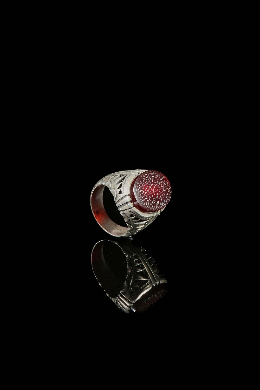 Lot 151: An Islamic Silver Ring Set with an Inscribed...