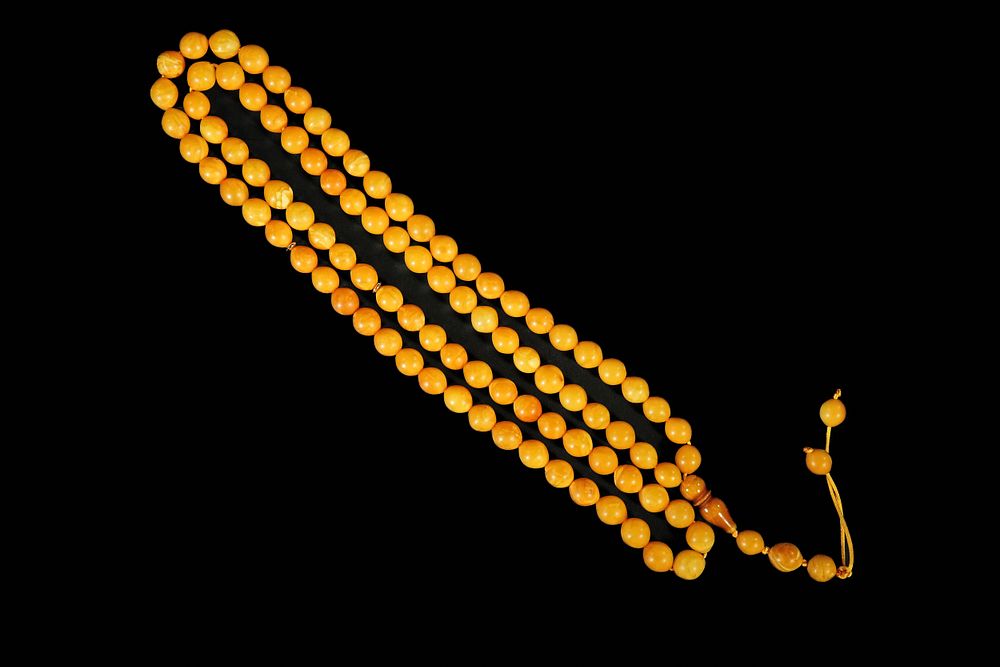 Lot 156: An Ottoman Amber Tasbih Prayer Beads.