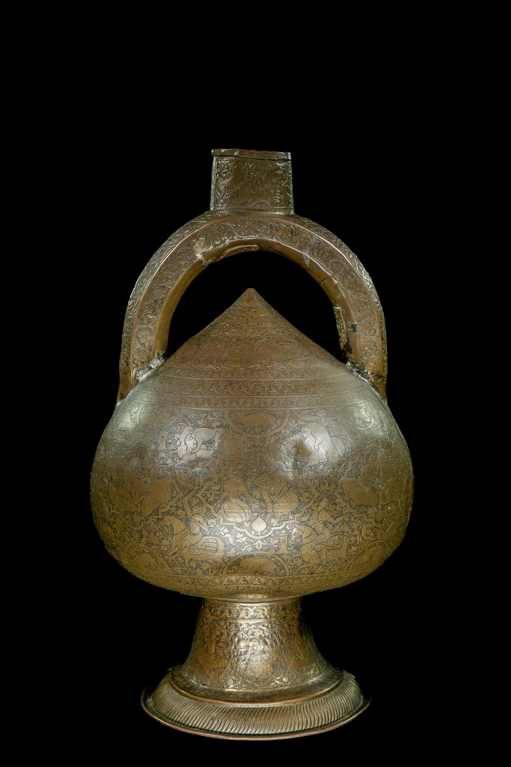 Lot 159: A Qajar Brass Spouted Vessel with Arched Handle,...