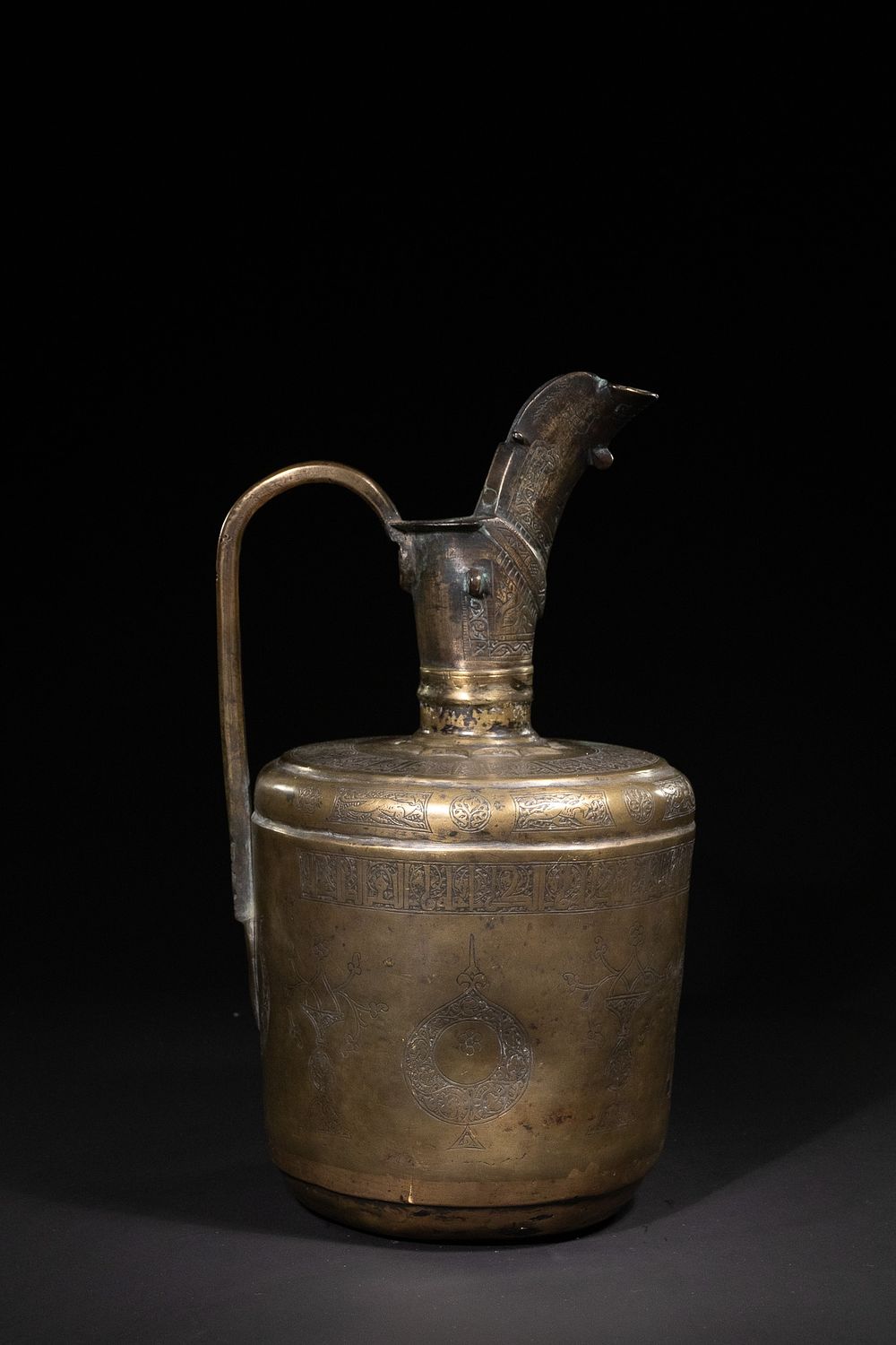 Lot 178: A Khorasan Bronze Ewer with Engraved Foliate and...