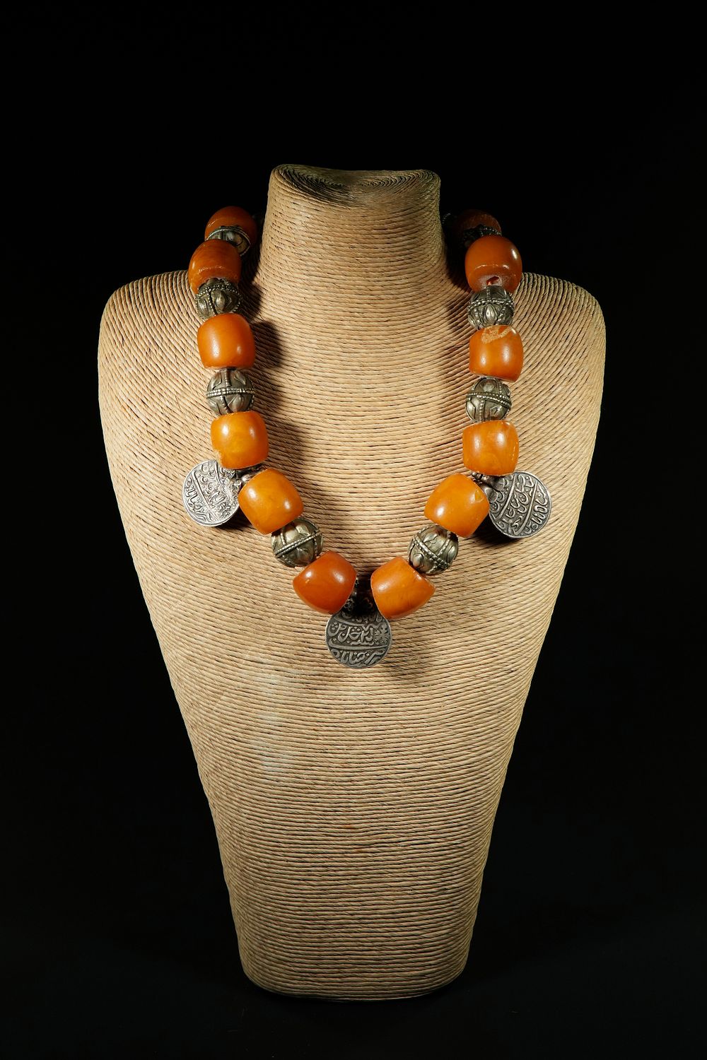 Lot 180: A Yemeni Amber and Silver Necklace.