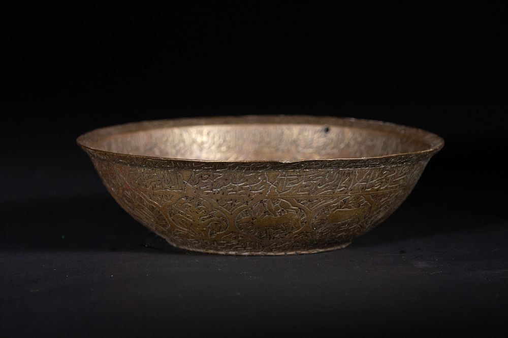 Lot 181: An Islamic Engraved Bronze Incantation Bowl.