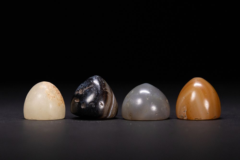Lot 195: A Lot of Four Islamic Agate Gaming Pieces,...