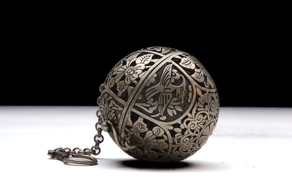 Lot 201: An Islamic White Metal Censer with Pierced Bird...