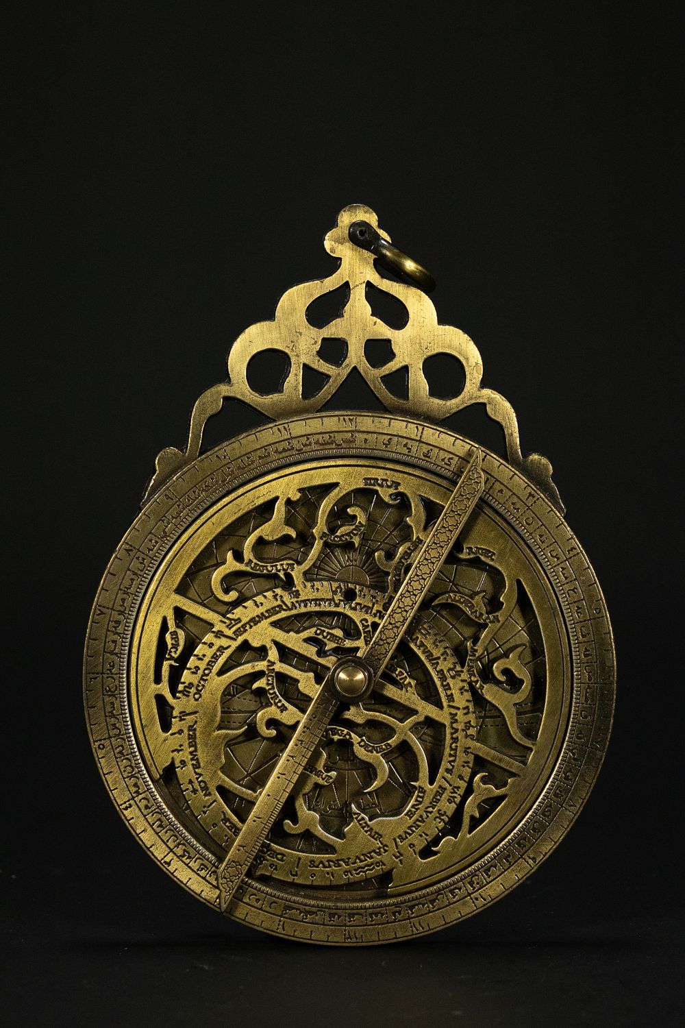 Lot 202: An Islamic Brass Astronomical Astrolabe with Arabic Inscriptions.
