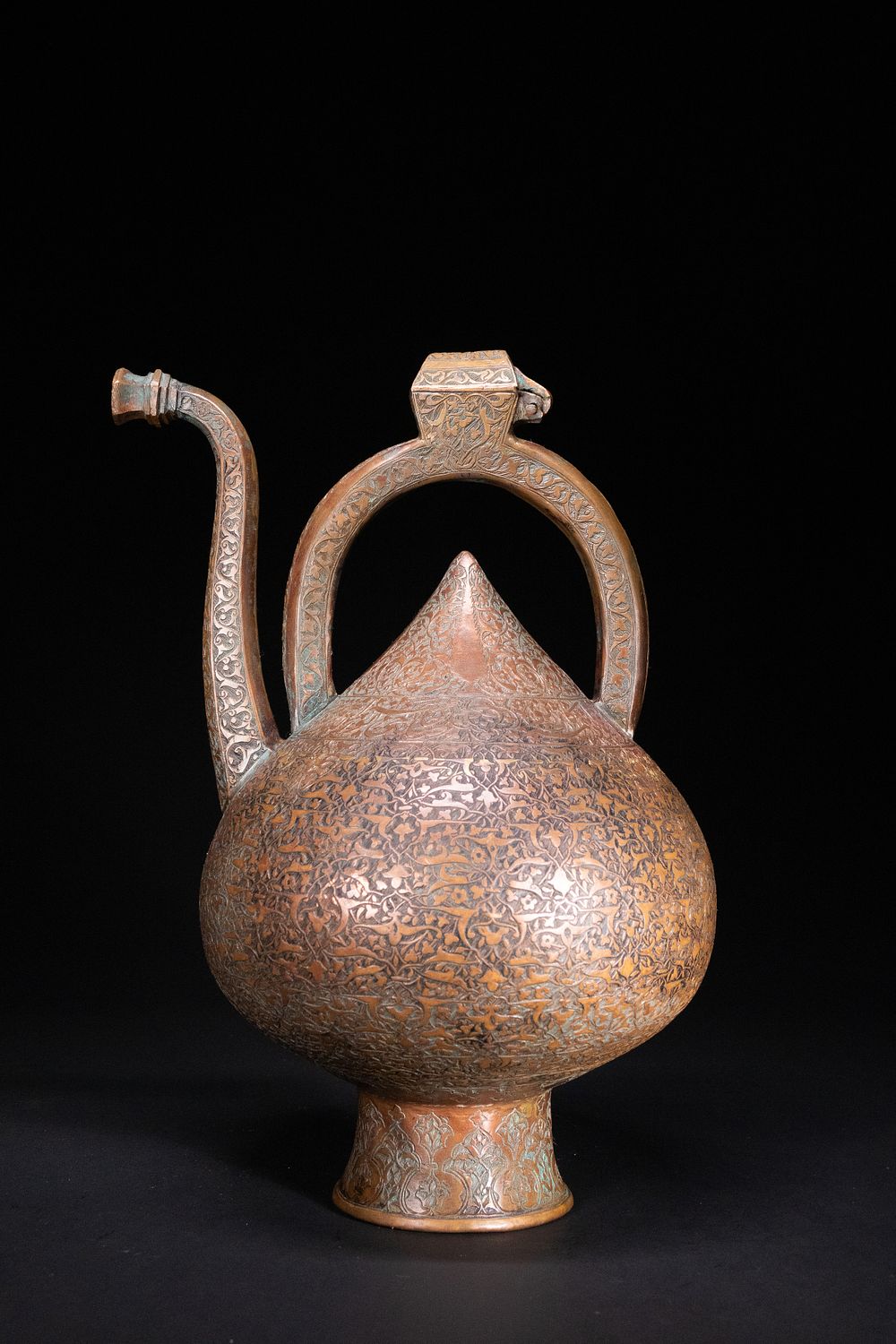 Lot 209: An Islamic Copper Ewer with Incised Scrollwork, 19th...