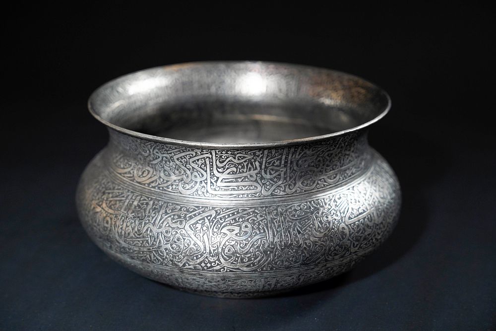 Lot 221: An Indian Deccan Engraved Copper Kashkul Beggar's Bowl,...