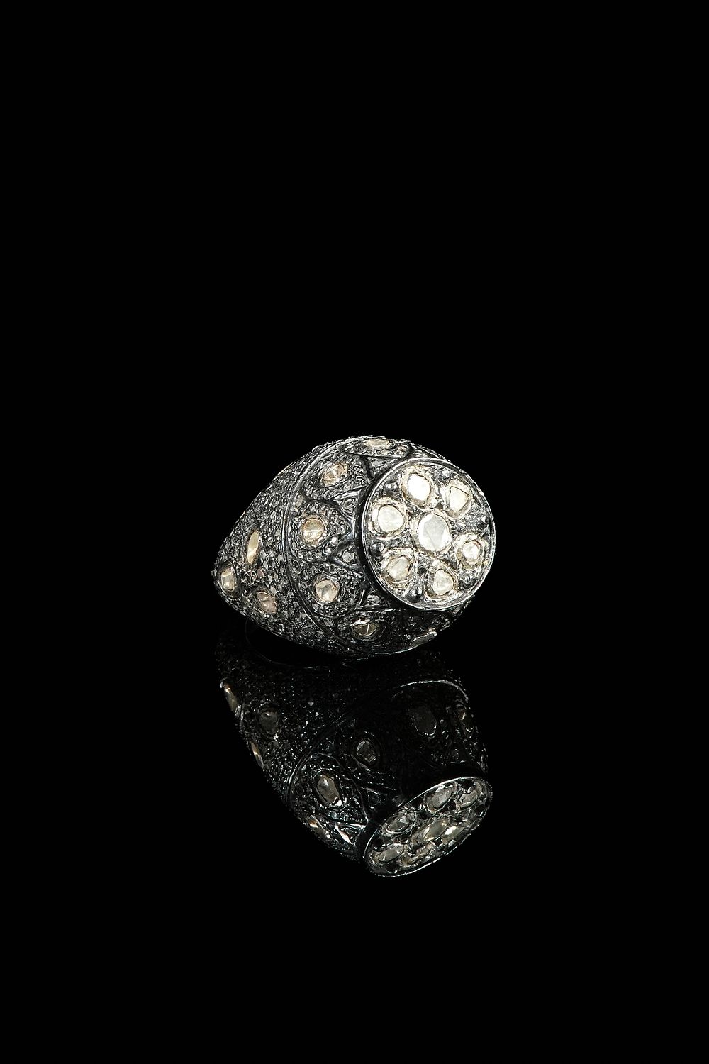 Lot 230: An Indian Silver and Diamond Ring.