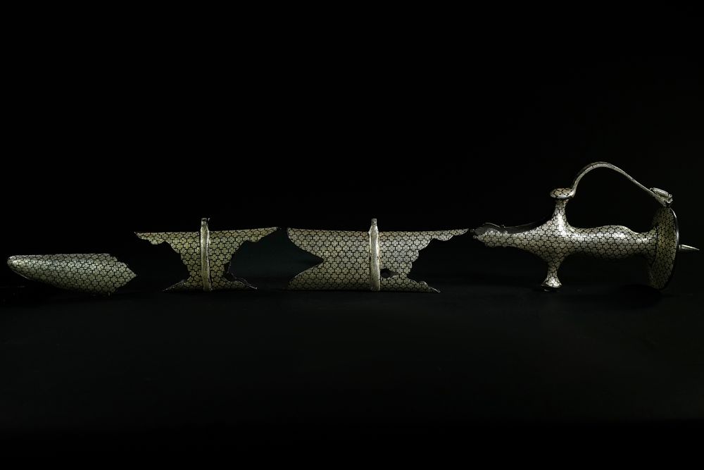 Lot 238: An Indian Steel Talwar with Silver-Inlaid Floral Motifs,...