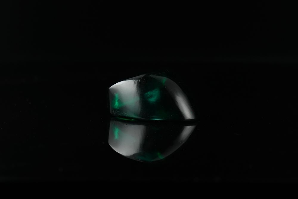 Lot 272: An Indian Green Glass Archer’s Thumb Ring, 20th...