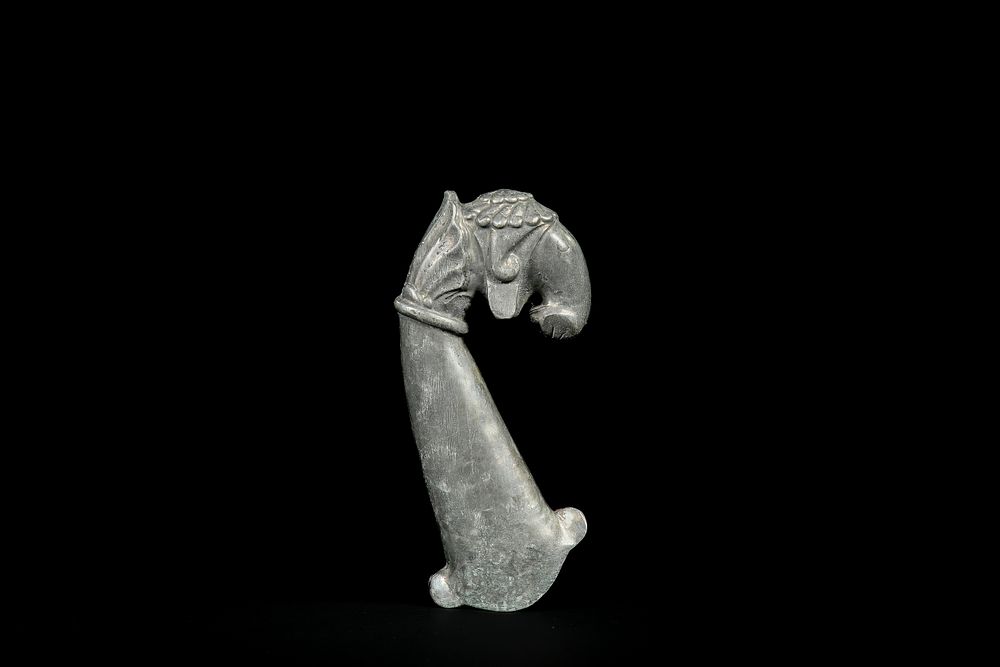 Lot 277: A Mughal Metal Dagger Handle with Elephant-Head Pommel.