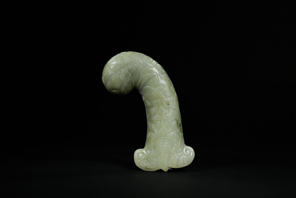 Lot 281: A Mughal Celadon Jade Dagger Hilt.