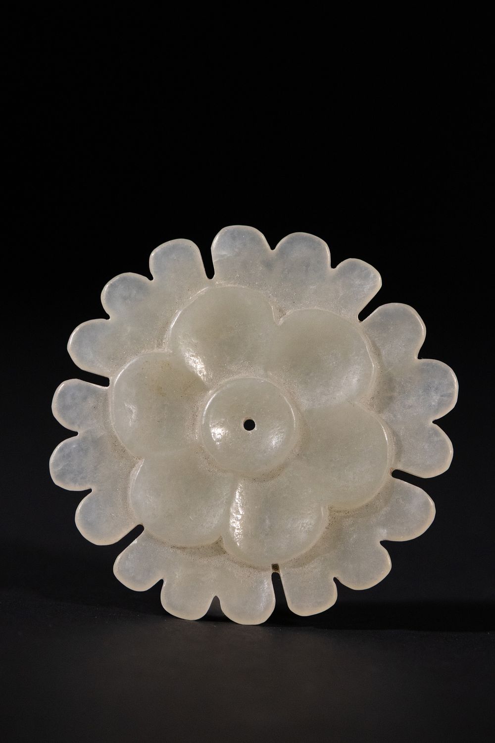 Lot 300: An Indian White Jade Floral Ornament, 19th Century.