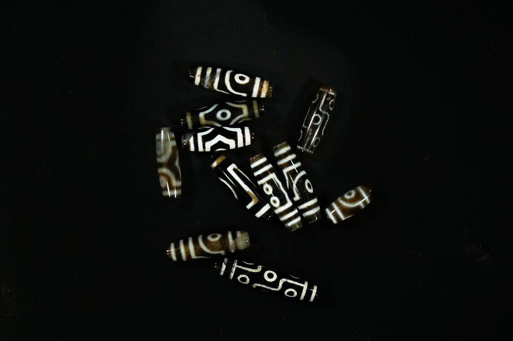 Lot 314: A Collection of Tibetan Dzi Beads.