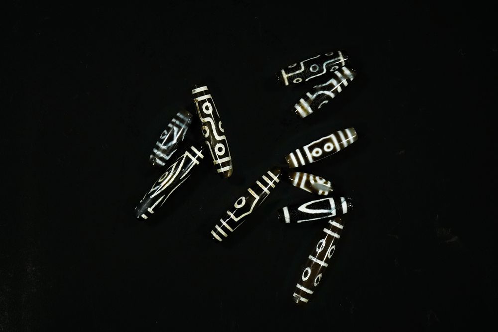 Lot 315: A Collection of Tibetan Dzi Beads.